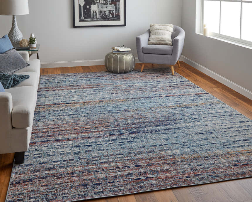 Living room with Feizy Edgemont rug in blue, ivory, and orange. Modern abstract design complements gray sofa and chair. Roomscene-Rectangle