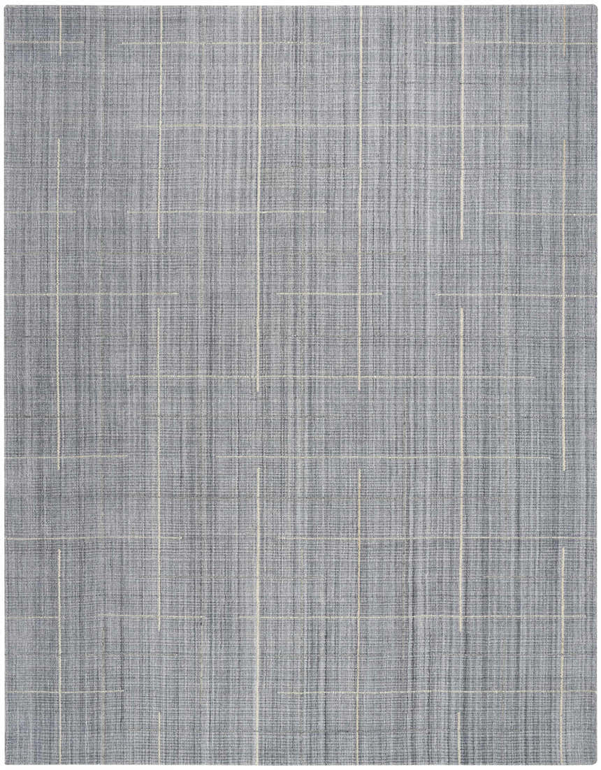Close-up of Calvin Klein CK041 Architectura Denim rug. Farmhouse style, handmade wool and rayon blend with subtle line pattern.