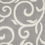 Close-up of the Nourison Grafix Grey rug showing its soft texture and swirling ivory contemporary pattern.
