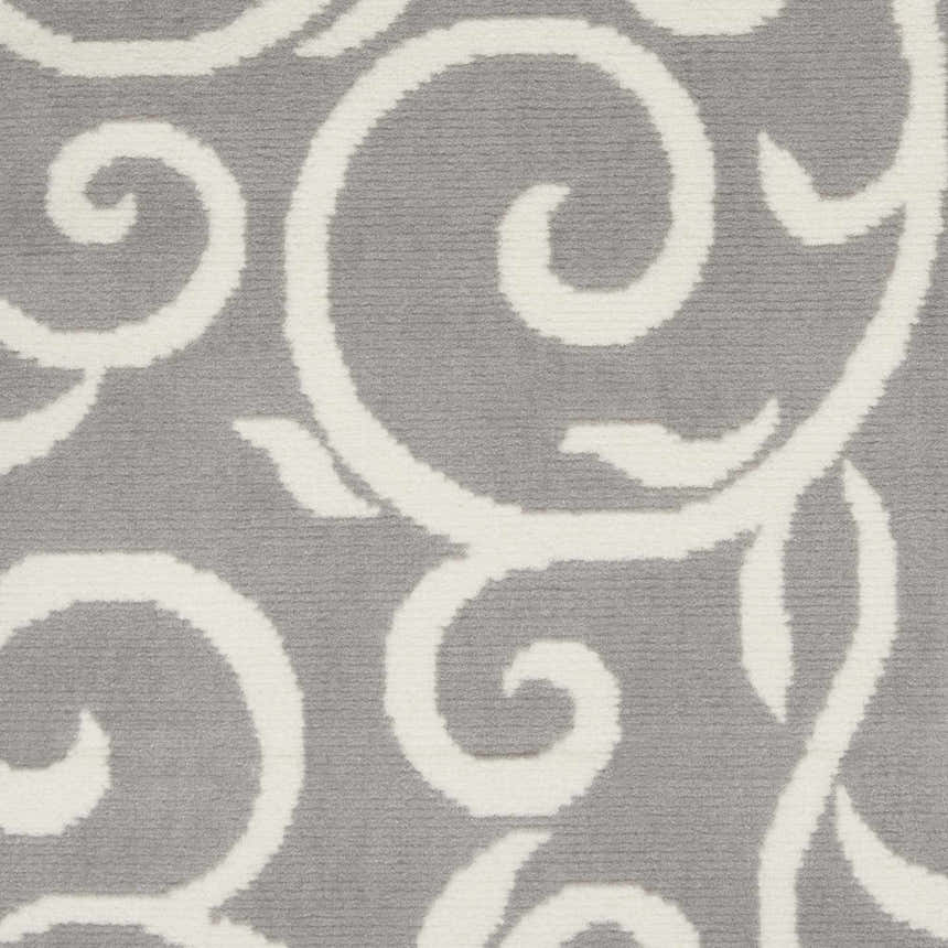 Close-up of the Nourison Grafix Grey rug showing its soft texture and swirling ivory contemporary pattern.