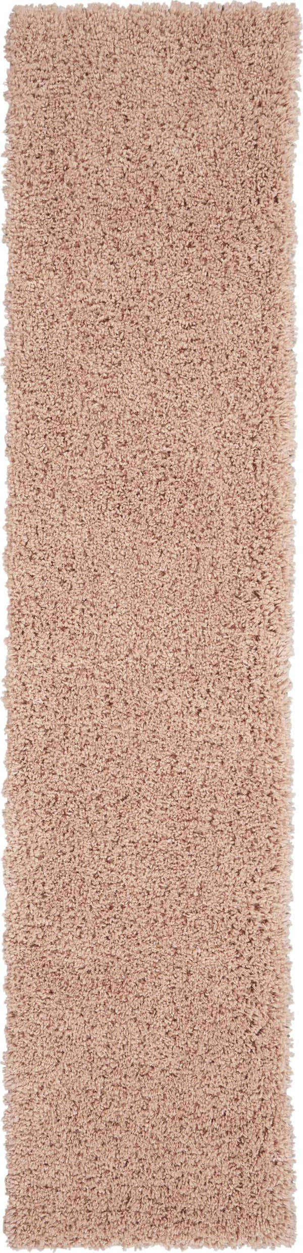 Close-up of the plush Nourison Malibu Shag Blush rug, showing its soft texture and subtle pink color.