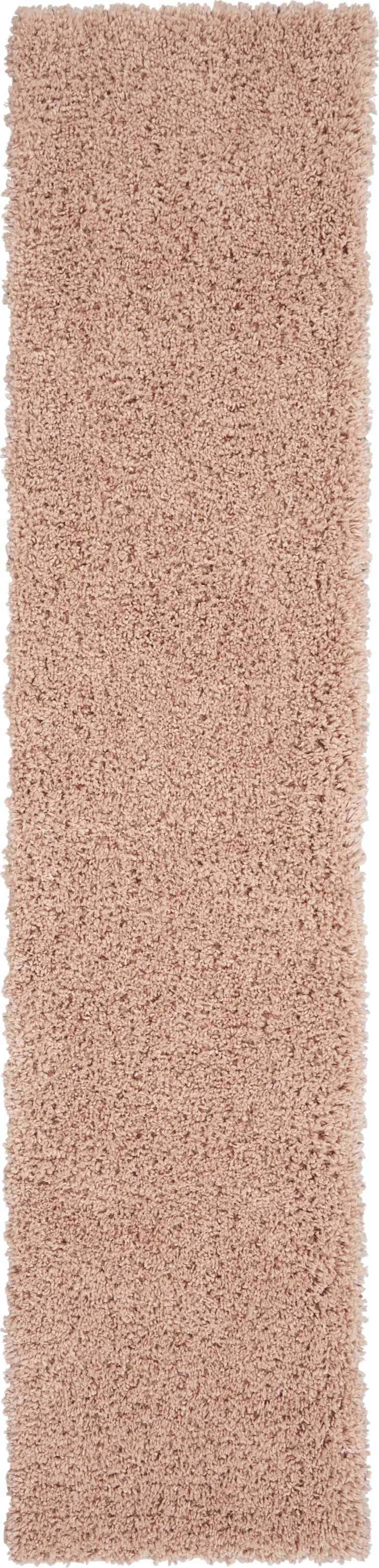 Close-up of the plush Nourison Malibu Shag Blush rug, showing its soft texture and subtle pink color.