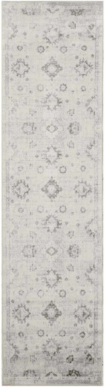 Close-up of Nourison Astra Machine Ivory Vintage Washable Area Rug, featuring chestnut floral and medallion pattern.