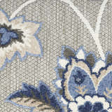 Close-up of Nourison Aloha Blue Grey Outdoor Area Rug showing floral pattern, blue, gray, and white colors.