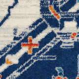 Close-up of Nourison Passion Blue Multicolor rug showing its bohemian design, blue base, and orange accent colors.