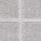 Close-up of the textured, high pile of the grey DKNY West End Ave shag rug.