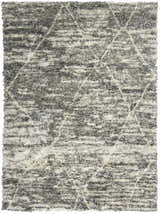 Close-up of the Calvin Klein San Antonio Charcoal Ivory Moroccan shag rug with a geometric diamond pattern.