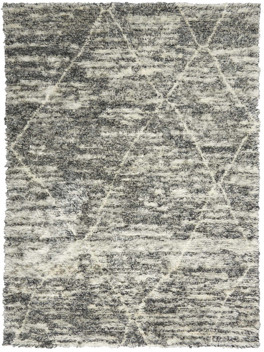 Close-up of the Calvin Klein San Antonio Charcoal Ivory Moroccan shag rug with a geometric diamond pattern.