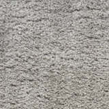 Close-up of the plush texture of a Nourison Dreamy Shag Silver Gray rug. Soft, dense shag pile.