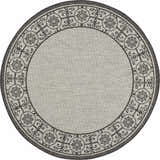 Close-up of round Nourison Country Side rug in ivory and charcoal. Features a floral and scroll border design.