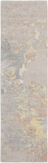 Close-up of Nourison Silk Shadows Silver rug. Abstract design with gray, beige, and yellow tones. Soft, silk-like texture.