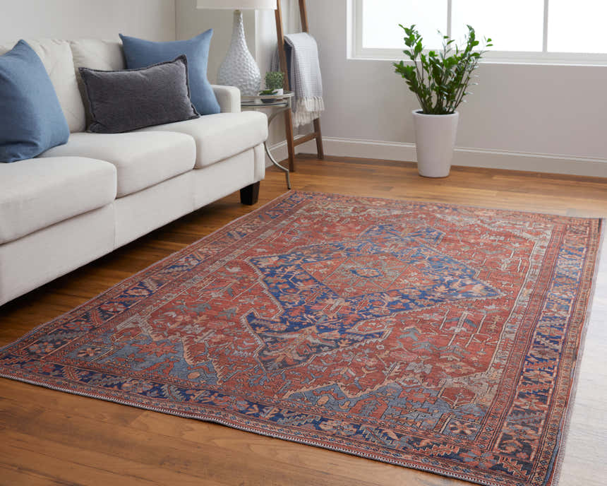 Living room with Feizy Rawlins Red/Tan/Blue Washable Area Rug, white sofa, blue pillows, wood floors, and bright natural light. Roomscene-Rectangle