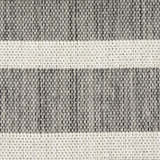 Close-up of the Nourison Positano Charcoal Ivory rug. Features a textured, woven design with charcoal and taupe hues.