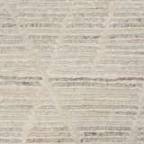 Close-up of the handmade Nourison OCEAN Pearl Rug. Features a textured, mid-century modern design in pearl and gray tones.