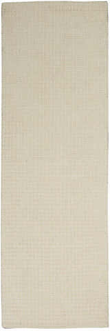 Close-up of the Calvin Klein Las Vegas Ivory Retro rug. Handmade wool rug with a subtle grid pattern.