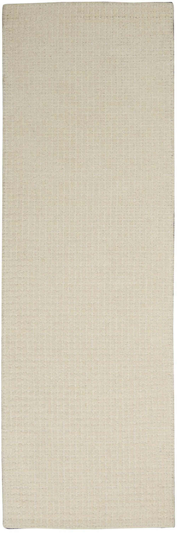 Close-up of the Calvin Klein Las Vegas Ivory Retro rug. Handmade wool rug with a subtle grid pattern.