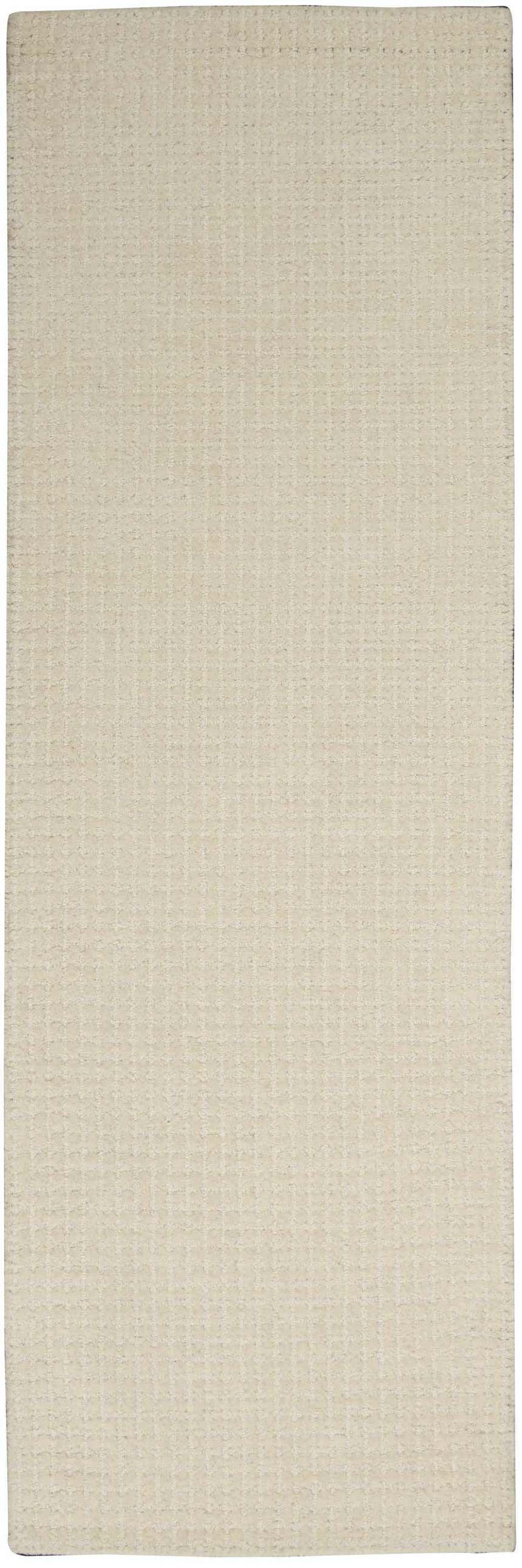 Close-up of the Calvin Klein Las Vegas Ivory Retro rug. Handmade wool rug with a subtle grid pattern.