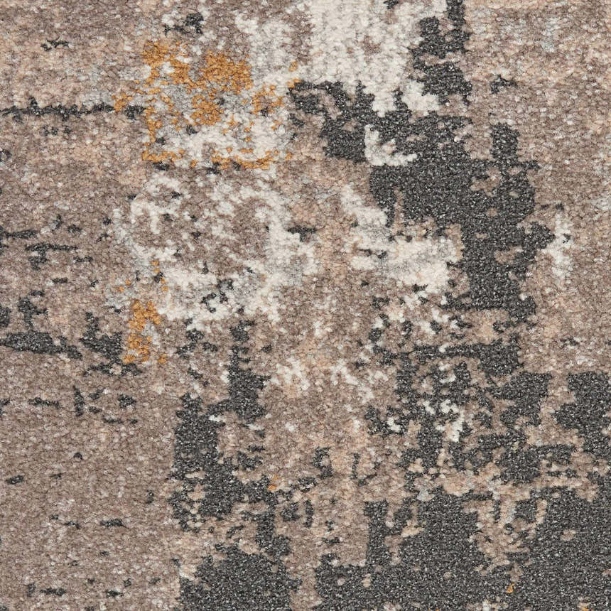 Close-up of the Nourison Tangra Cream Grey rug showing its abstract pattern and textured weave.