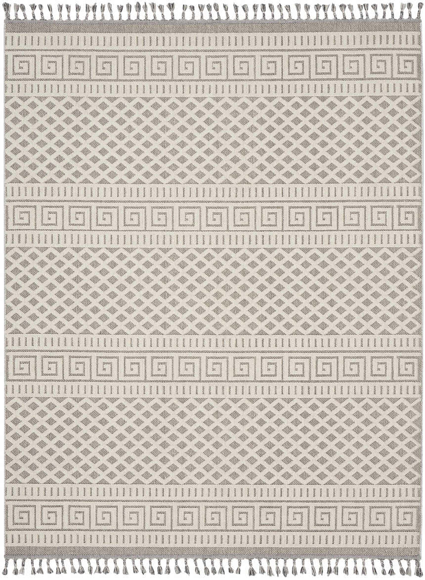 Close-up of Nourison Paxton Ivory/Grey rug. Features diamond and Greek key patterns, plus tassels. Mid-Century Modern style.