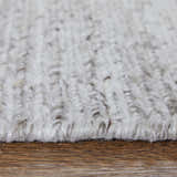 Close-up of the hand-knotted Feizy Finley Modern Solid Silver Area Rug showing texture and color. Pile