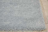 Close-up of the plush texture and slate taupe color of the Nourison Malibu Shag area rug.