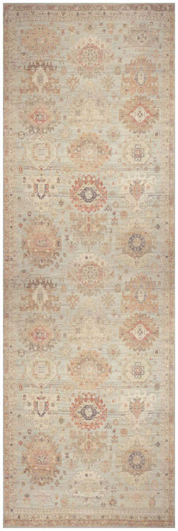 Close-up of Nourison Vintage Sage Multicolor rug. Distressed vintage style with geometric patterns in sage, beige, and peach tones.