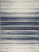 Close-up of the Nourison Key Largo Blue Contemporary Area Rug featuring a striped light blue and dark blue pattern.