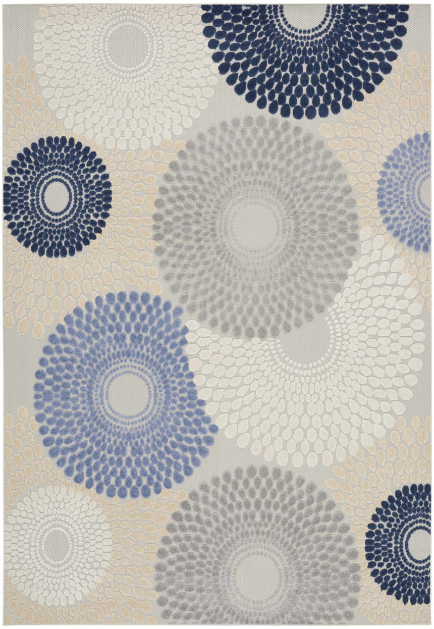 Close-up of the Nourison Aloha Blue Grey Modern Area Rug featuring a floral burst pattern in blue, gray, and ivory.