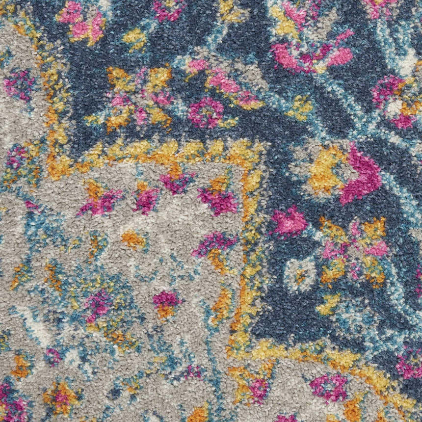 Close-up of Nourison Passion Multicolor Farmhouse rug. Features floral pattern in pink, yellow, blue, and gray.