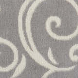 Close-up of the Nourison Grafix Grey Contemporary Indoor Area Rug, showing the gray and white swirling pattern.