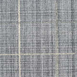 Close-up of the Calvin Klein CK041 Architectura Denim Rug. Farmhouse style rug with a textured denim color and subtle grid pattern.