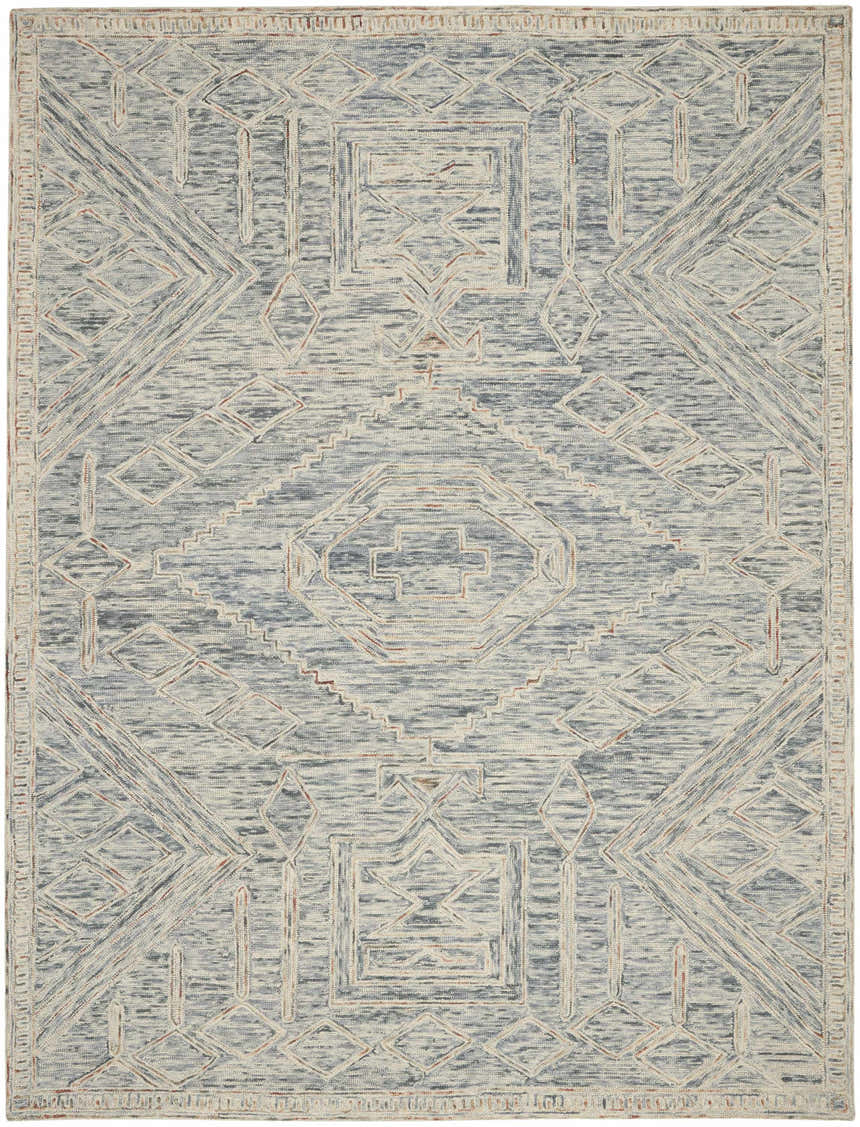 Close-up of Nourison Interlock Blue Multicolor rug. Bohemian design with geometric patterns in blue, cream, and hints of terracotta.