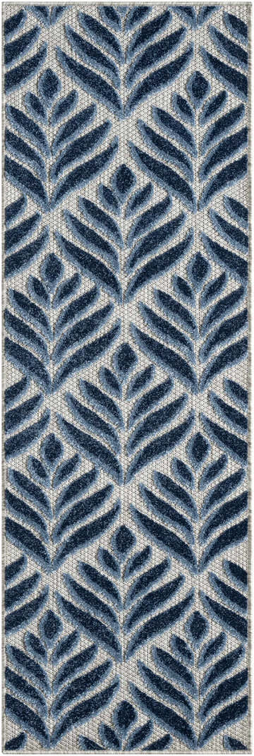 Close-up of Nourison Aloha Blue Outdoor Area Rug. Features a leaf-like pattern in light and dark blue on a textured background.