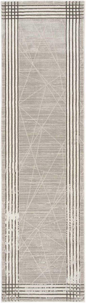 Close-up of the Nourison Desire Grey Silver rug. Modern design with linear pattern and striped border.