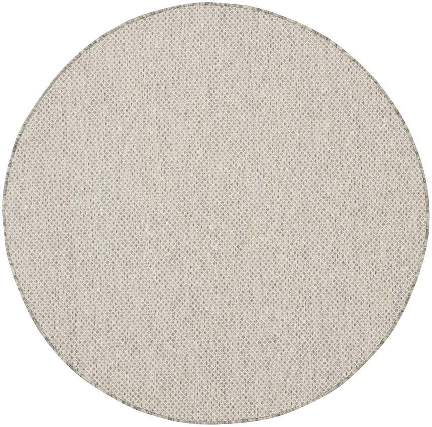 Close-up of round Nourison Courtyard Ivory Silver rug. Woven polypropylene texture in neutral ivory and silver tones.