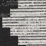 Close-up of the Nourison Modern Passion Black Grey rug showing its mid-century modern pattern and textured polypropylene material.