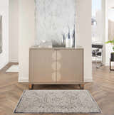 Entryway with a Nourison Lynx Ivory Charcoal Vintage Indoor Area Rug, wood floors, and modern cabinet.
