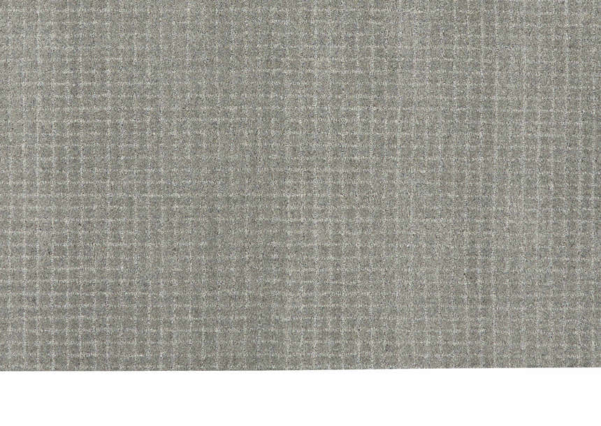Close-up of the grey Calvin Klein Las Vegas rug. Retro style with a subtle grid pattern and wool texture.