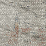 Close-up of Nourison Rustic Textures Light Grey Rust rug. Modern design with light gray, rust, and blue hues. Textured pattern.