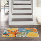 Entryway with Nourison Aloha Multicolor rug featuring starfish and seashells. Coastal decor.