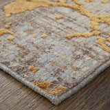 Close-up of Feizy Pryor rug showing gold abstract design on gray, brown, and dark red textured background. Corner