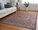 Living room with a Feizy Rawlins Brown/Red/Ivory rug, white sofa, wood floors, and natural light. Roomscene-Rectangle