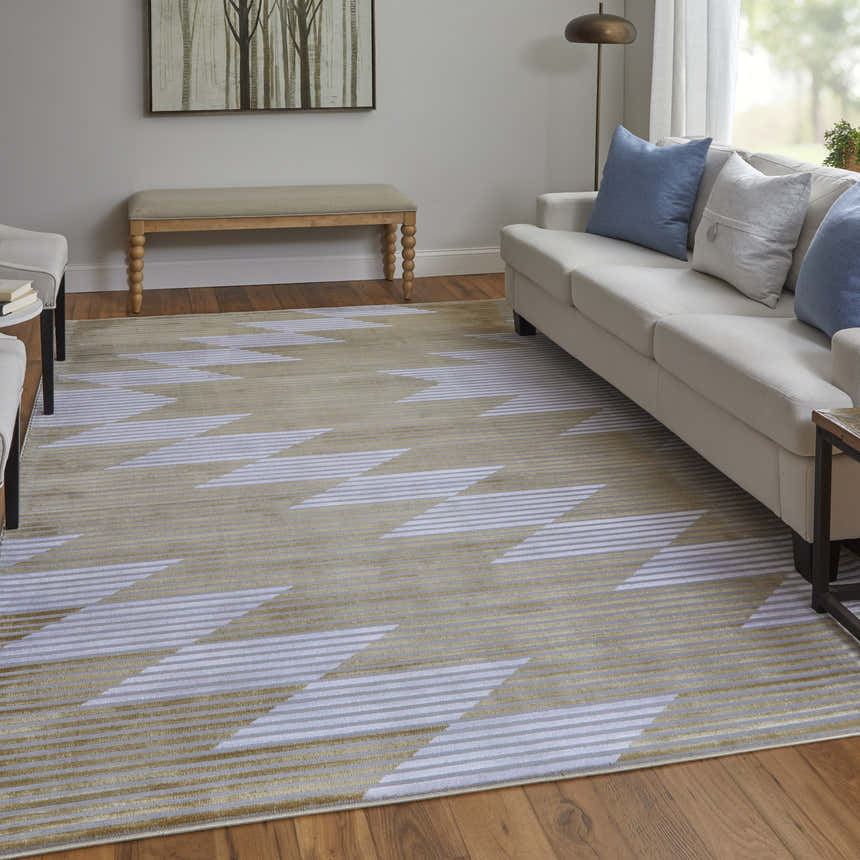 Living room scene with a Feizy Marigold rug in gold, gray, and white with a geometric design. Roomscene-Rectangle