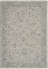 Close-up of the Nourison Infinite Light Grey Vintage Indoor Area Rug, showcasing its floral pattern and soft, muted colors.