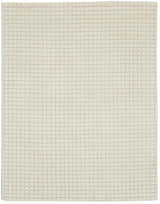 Close-up of the Calvin Klein Pretoria Ivory rug showing the handmade mohair wool texture and grid pattern.