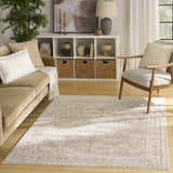Living room scene with a cream beige sofa and the Nourison Dekor Vintage Area Rug.