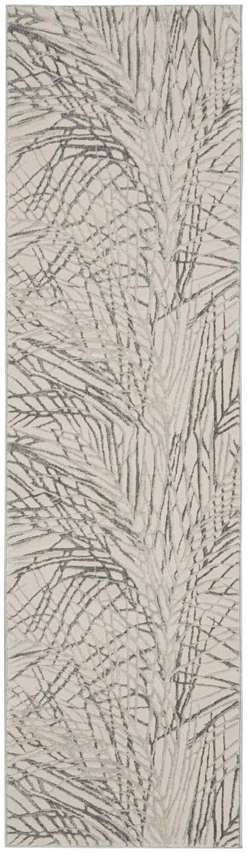 Close-up of the Nourison Rustic Textures Ivory/Grey Area Rug featuring a modern, abstract branch design.