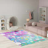 Kids room with a Nourison Imagination Purple rug featuring sports icons, egg chair, and pink sofa.