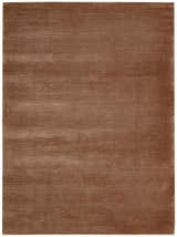 Close-up of the handmade Calvin Klein Home Lunar Foal rug, featuring a subtle horizontal line pattern and soft foal brown color.