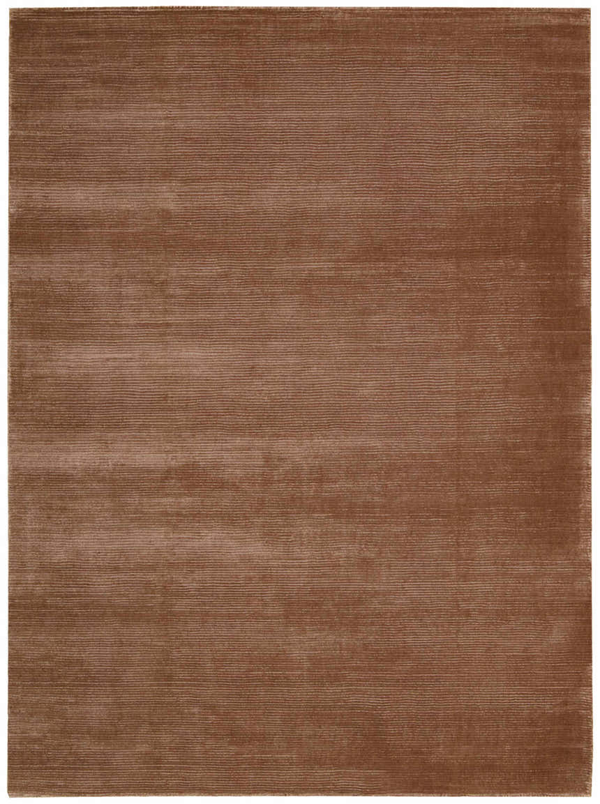 Close-up of the handmade Calvin Klein Home Lunar Foal rug, featuring a subtle horizontal line pattern and soft foal brown color.